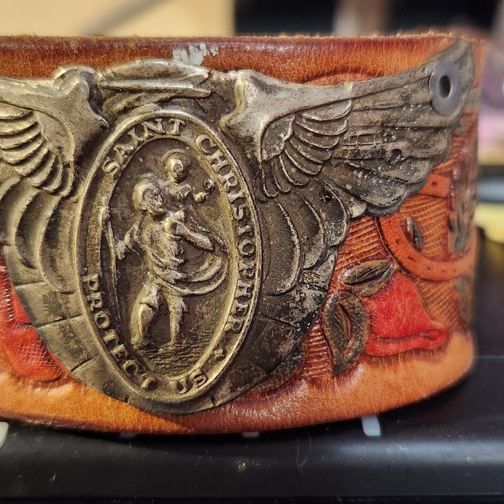 Leather wrist cuff with antique Saint Christopher medal